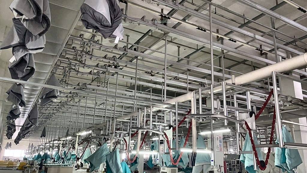 CleverMax hanger system feeding the sewing floor at NewSega Home Textiles
